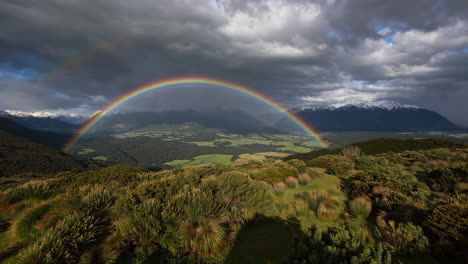 stunning rainbow arching over a verdant mountain valley