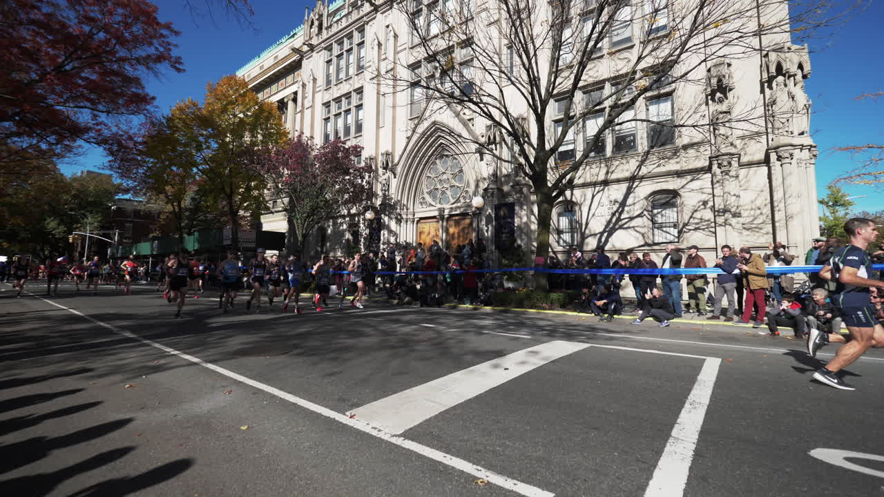 Runners Compete in a Marathon on a Sunny Autumn Day in the City