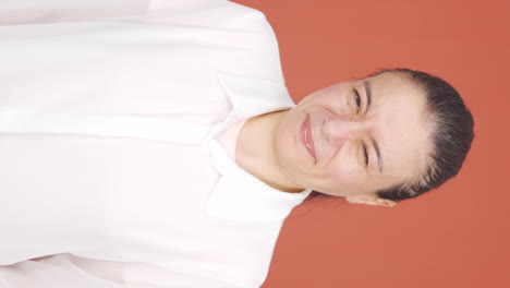 vertical video of the woman is disgusted.