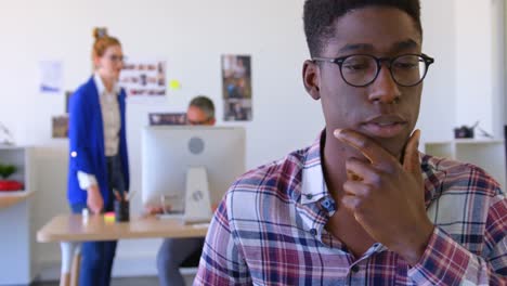 handsome african-american male executive using laptop in modern office 4k