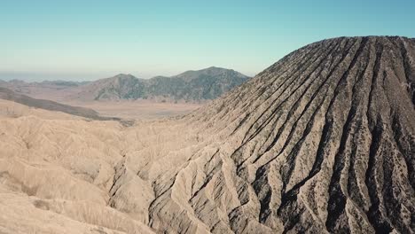 surreal drone footage of volcanoes land around mount bromo, east java, indonesia. extraordinary and surreal views, showing totally different landscape of earth.