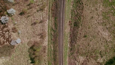 Tracking-drone-shot,-looking-down-at-railway-tracks