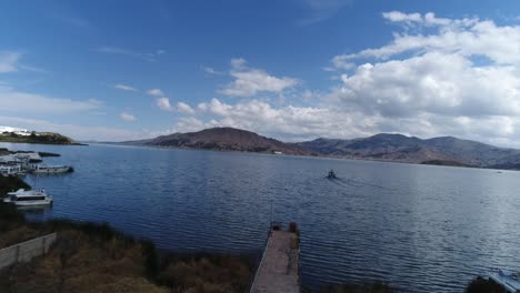 drone movement in the city of puno on a beautiful sunny day over titicaca lake, peru