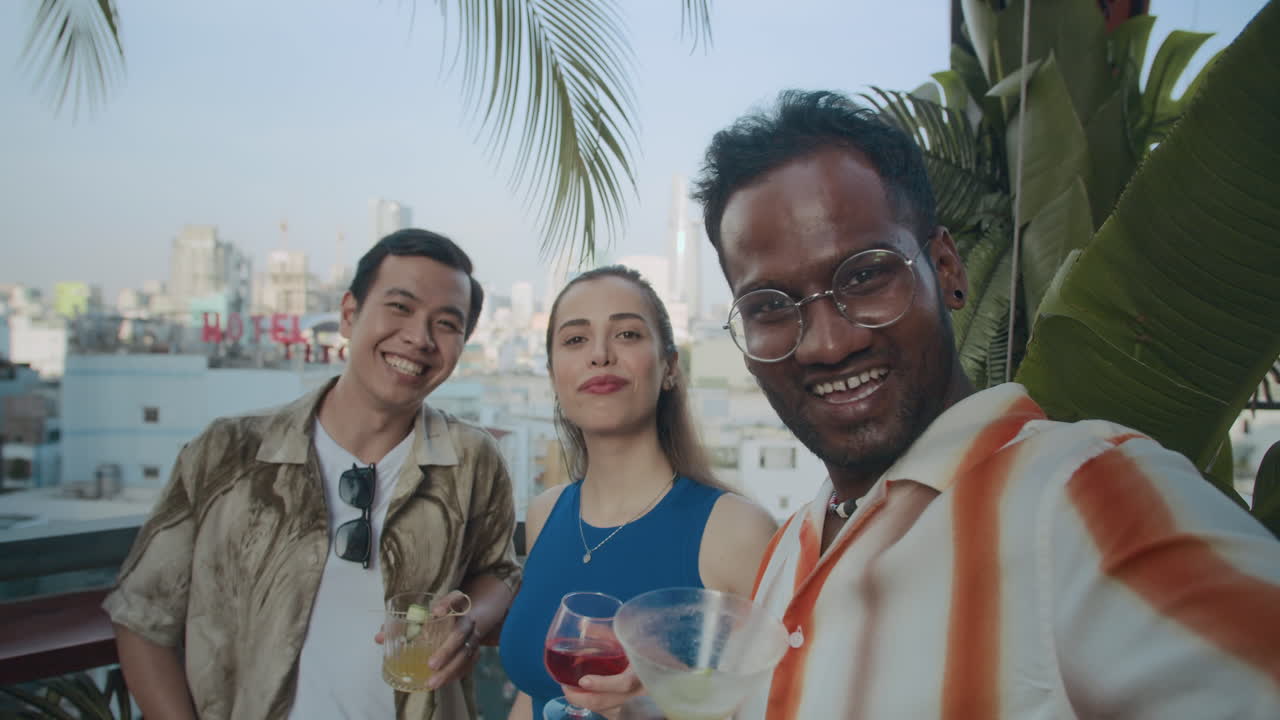 Group of Friends Smiling when Taking Selfie in Bar POV