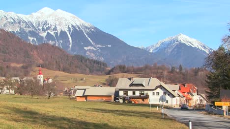 Cars-drive-through-the-countryside-of-Slovenia-or-an-Eastern-European-nation-1