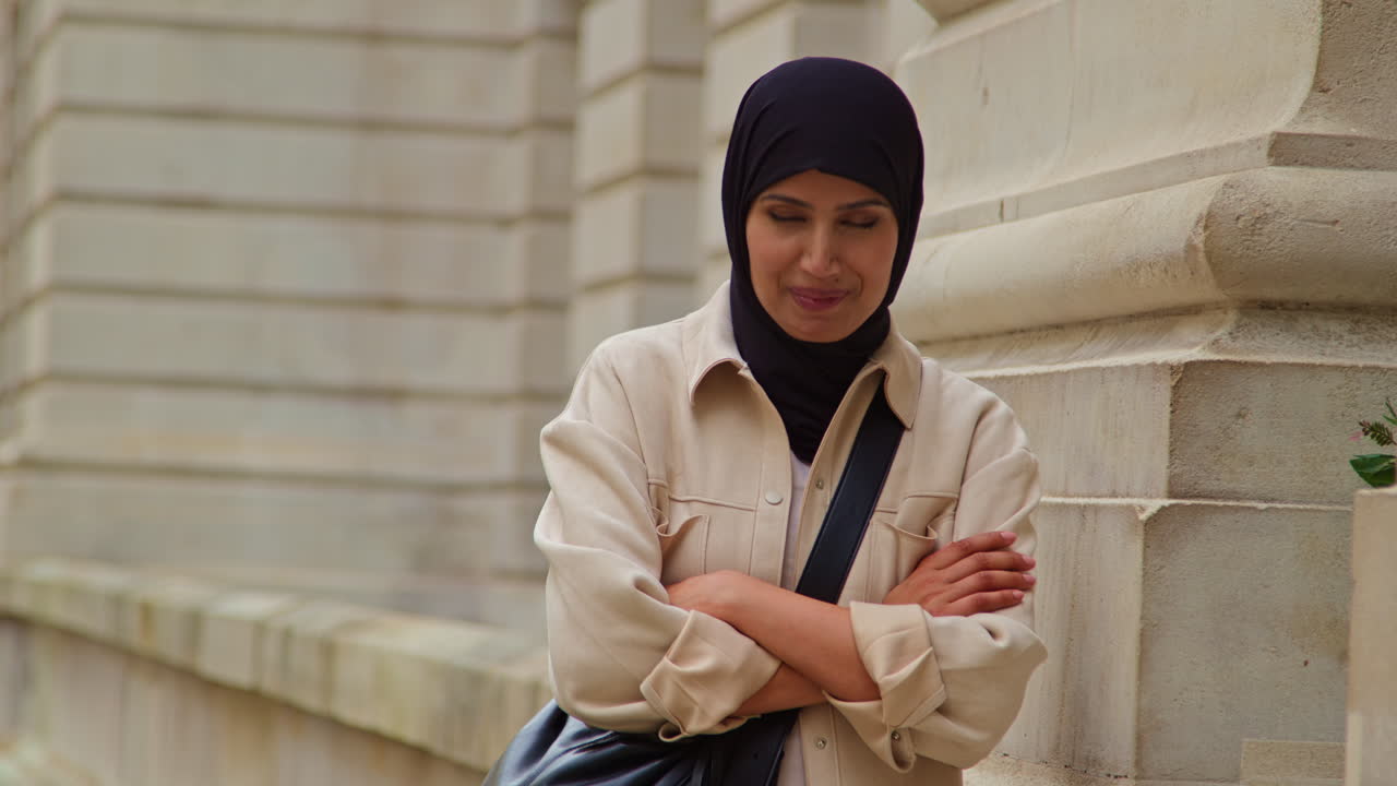 Portrait Of Smiling Muslim Businesswoman Wearing Hijab And Modern Business Suit Standing Outside City Office Buildings 2