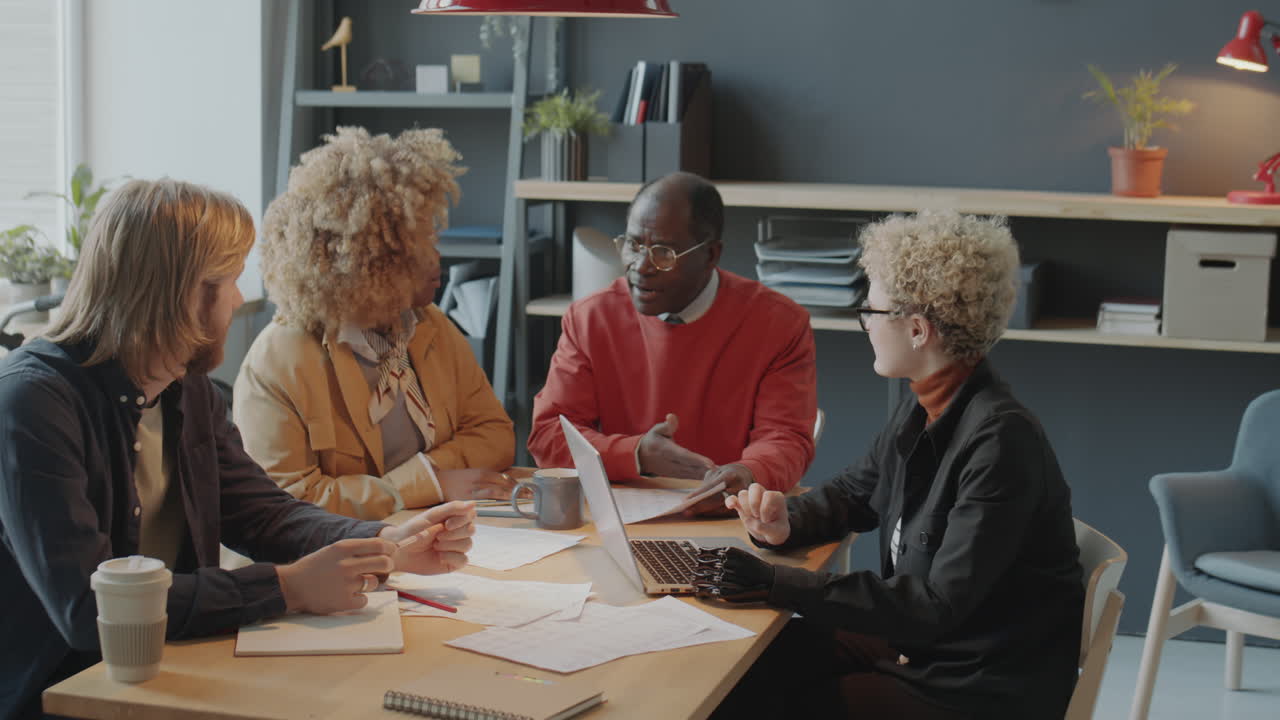 Diverse Coworkers Having Meeting in Office
