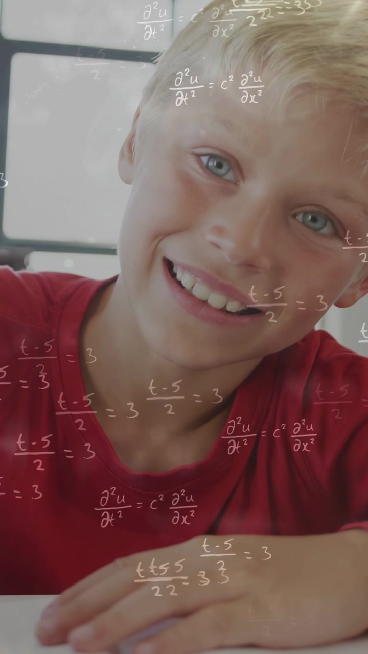 Vertical video: Boy gazing, tracing worksheet at desk, equations floating, solving math and smiling