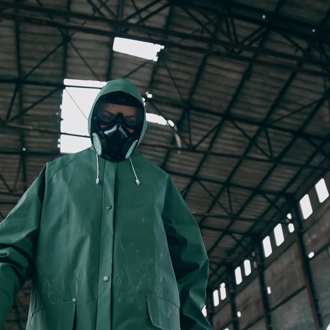 Man in gas mask on ruins. Man with gas mask and decontamination suit