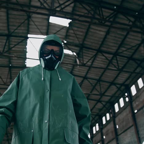 man in gas mask on ruins. man with gas mask and decontamination suit