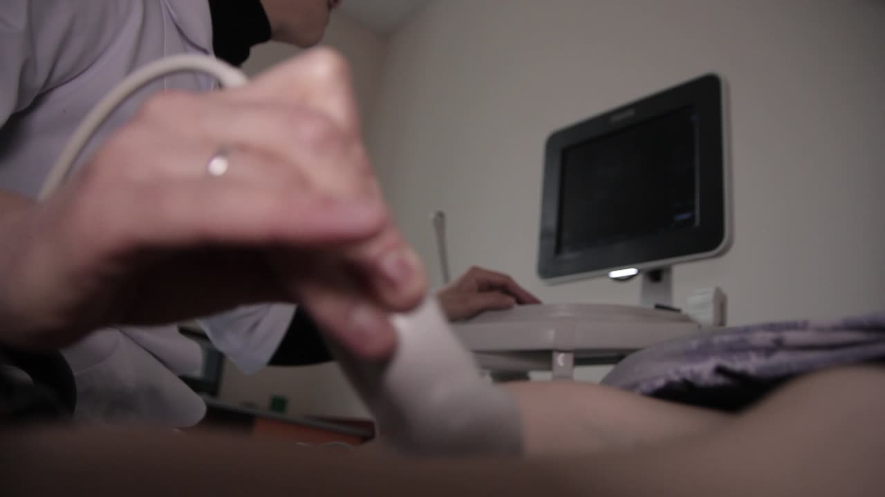 Ultrasonography (USG). Close-up of doctor hand doing medical ultrasound