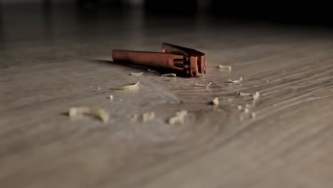 nail clippings and clippers on wood, dramatic light of personal grooming, 4k