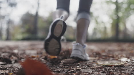 Black-athlete-tying-shoe-lace-before-sprinting