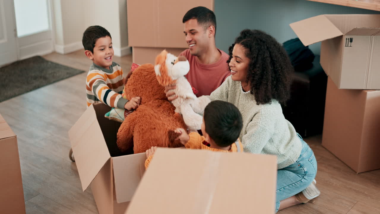 Moving, toys and family with cardboard boxes