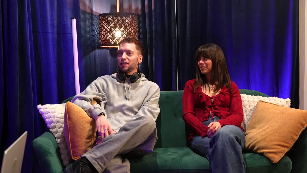Man and Woman Talking on a Couch in a Casual Interview Setting