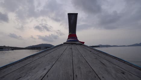 landscape of the head front of local boat while sailing in sea ocean in early morning time