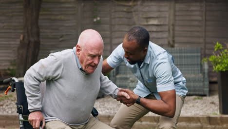 caregiver assisting elderly man
