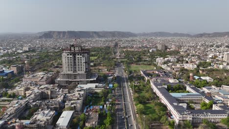 aerial shot of a majestic underconstuction buildings with solar panels and urban buildings