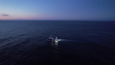 tuna fishing boat fishing at night in the atlantic ocean, azores