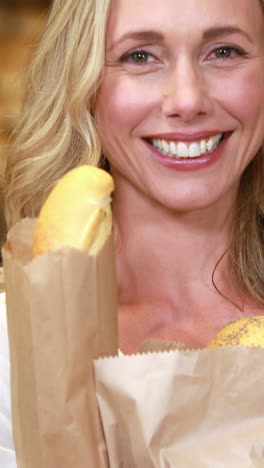 smiling blonde holding paper bags