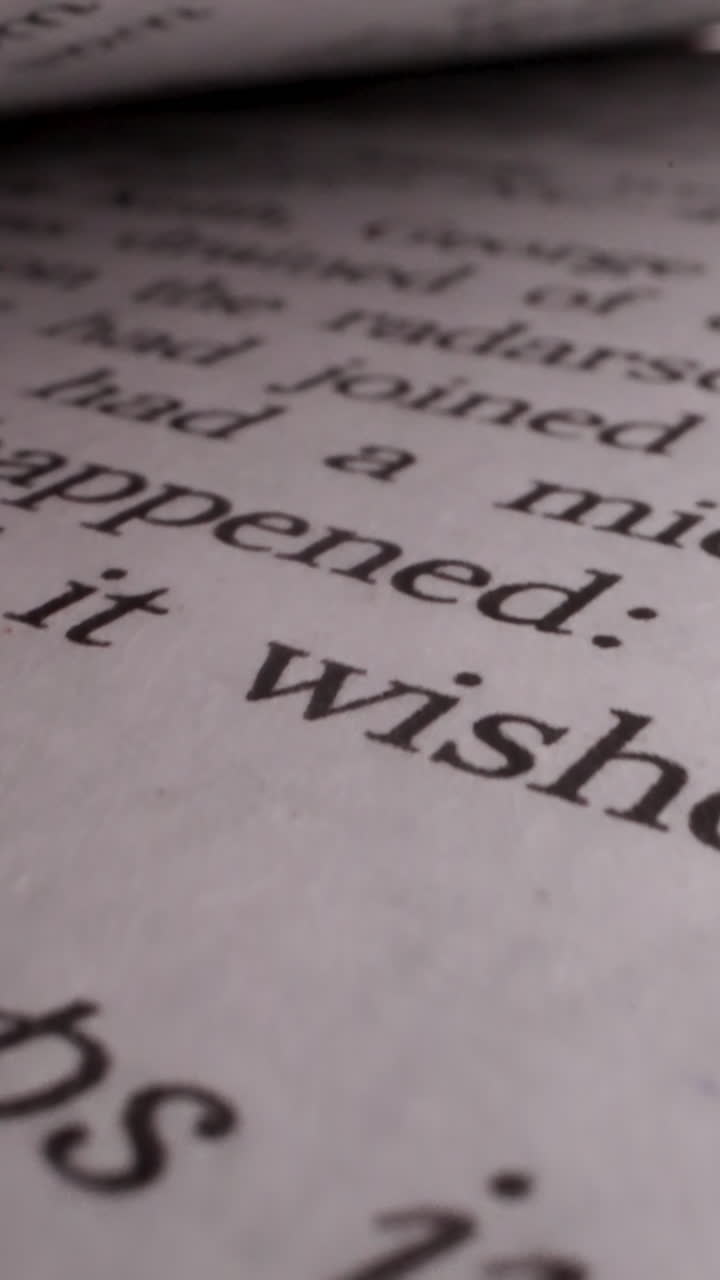 Open book with story text on page in light studio macro view. Learning information and modern literature. Read different books to study and have rest