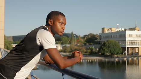 handsome african american male athlete resting in sportswear on a sunny afternoon. copy space. young black man outdoors.