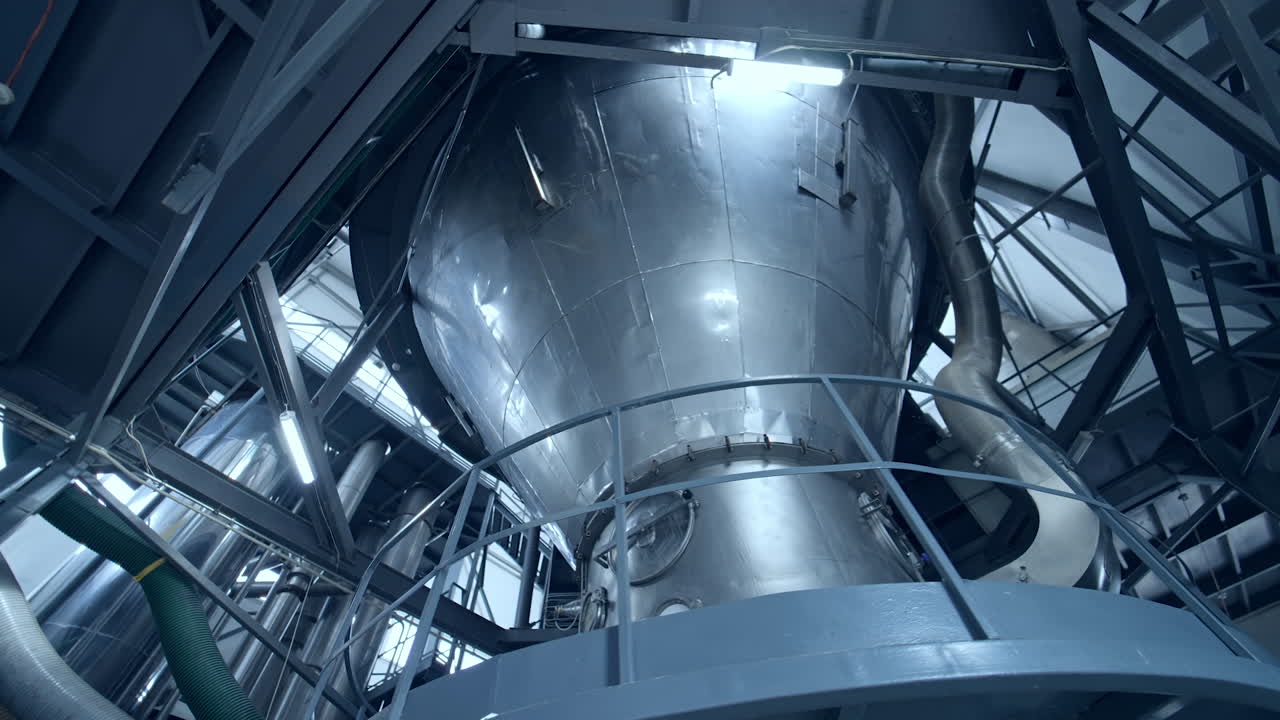 Interior of dairy factory with fermentation tank. Technology equipment at dairy farm. Sterile production