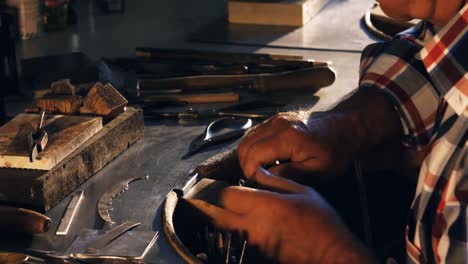 goldsmith working in workshop