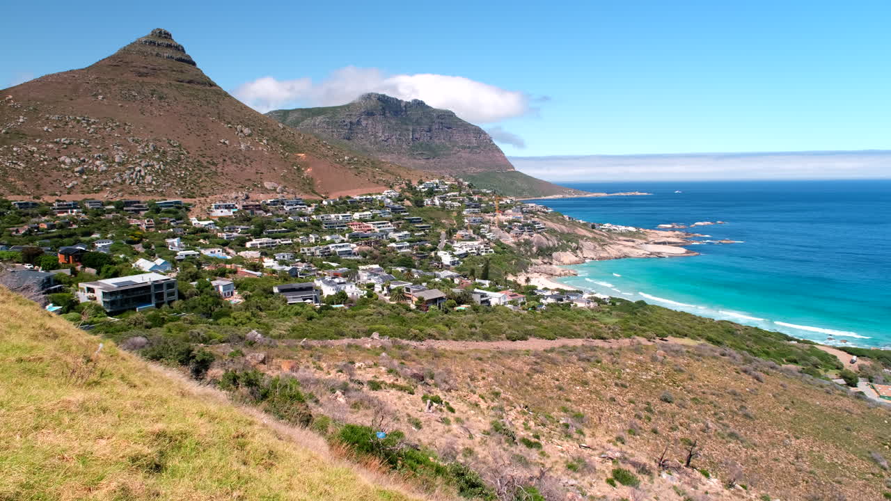 Wide panning view of scenic and exclusive seaside Cape Town suburb of Llandudno