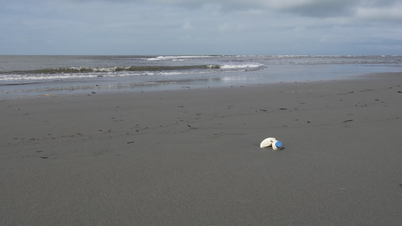 Plastic waste on the beach Pacific Ocean coastline in Colombia, toxic for sea life creatures