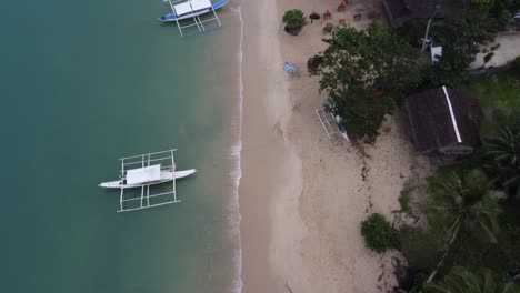 Calm-Port-Barton-Beachfront-in-Early-Morning,-Drone-Bird's-eye-View