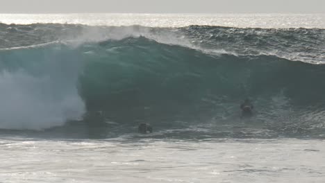 friends waiting a wave to surf.