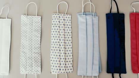 Panning overview of different types of ready-to-wear masks for covid-19