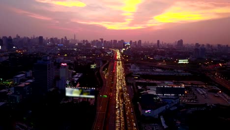 fly over the highway traffic in twilight
