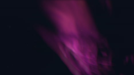 bright red and purple flame with smoke emanating, captured in this vibrant image. the brilliance of the flame and the swirling smoke create a mesmerizing and captivating visual