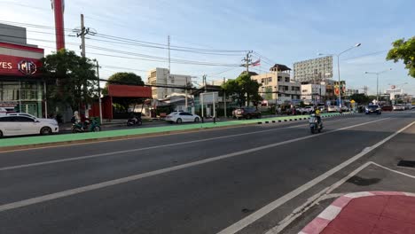 vehicles moving through a bustling urban crossroad