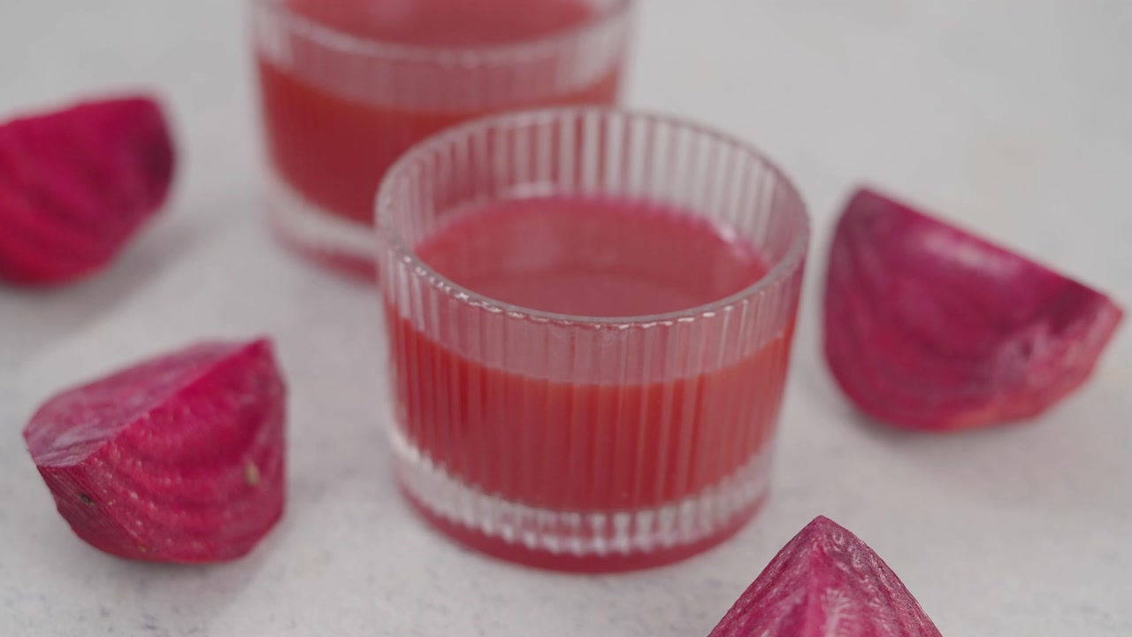 Fresh Beetroot Juice in Glasses with Raw Beetroot Pieces