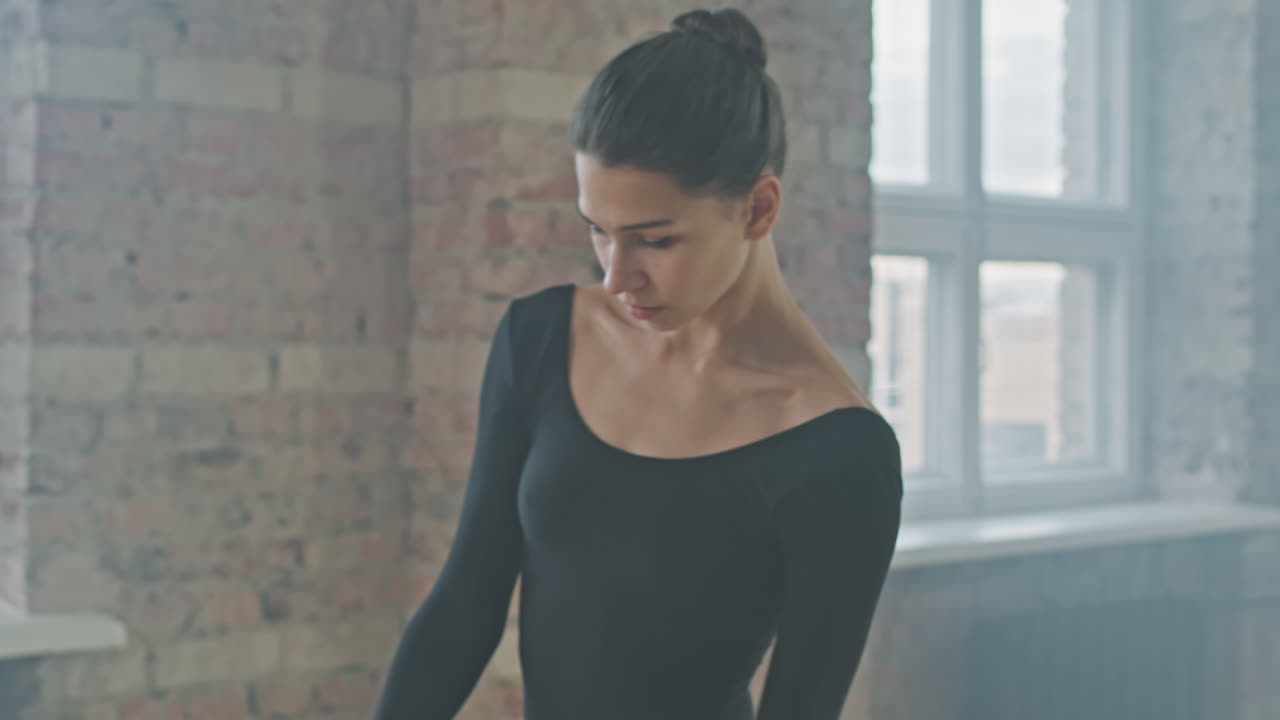 Beautiful Ballerina Performing Solo In Studio