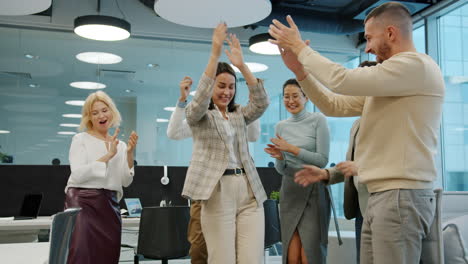 happy office workers dancing
