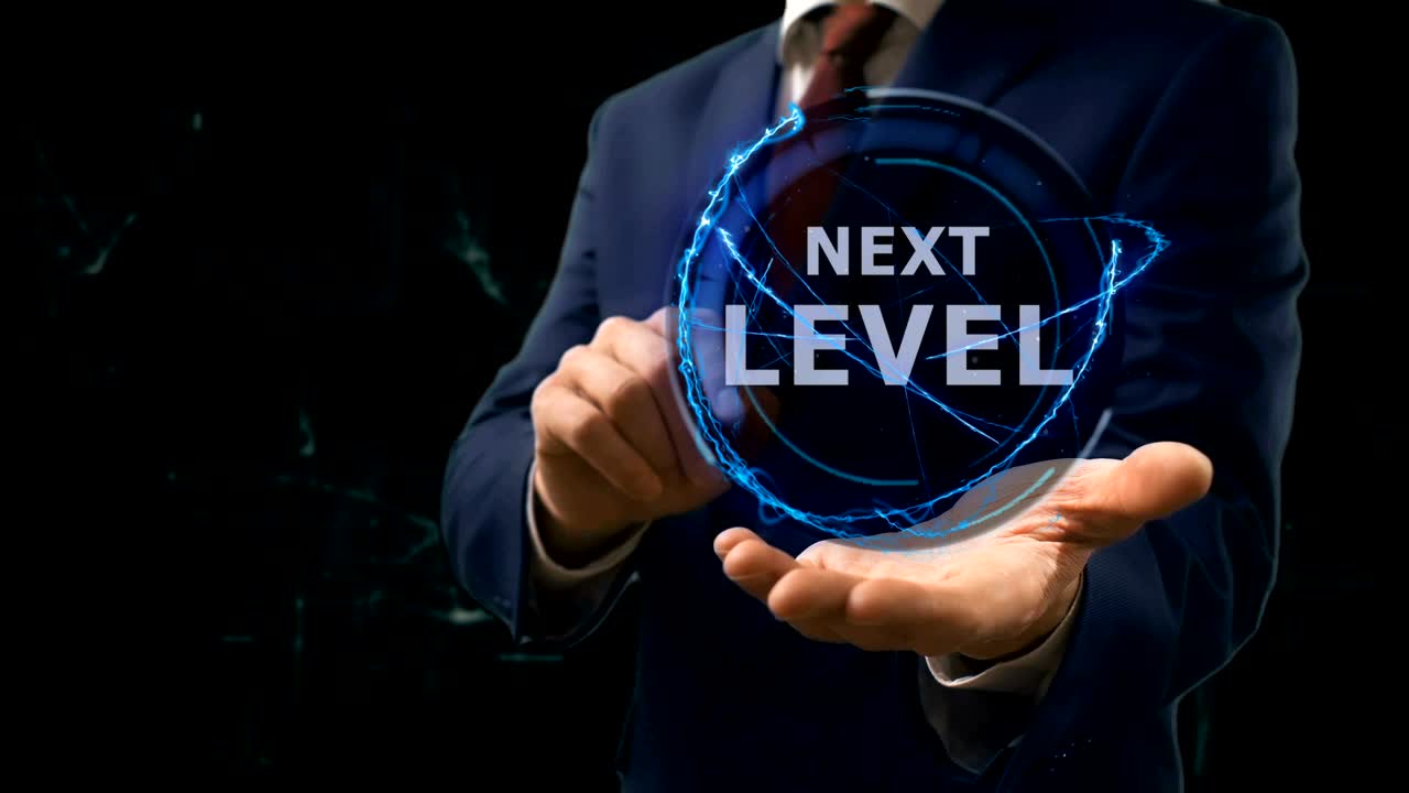 Businessman shows concept hologram Next level on his hand