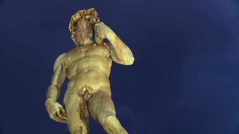 time lapse of state of david at dusk in florence italy with moon in background 1