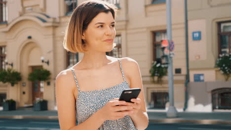 woman using smartphone outdoors