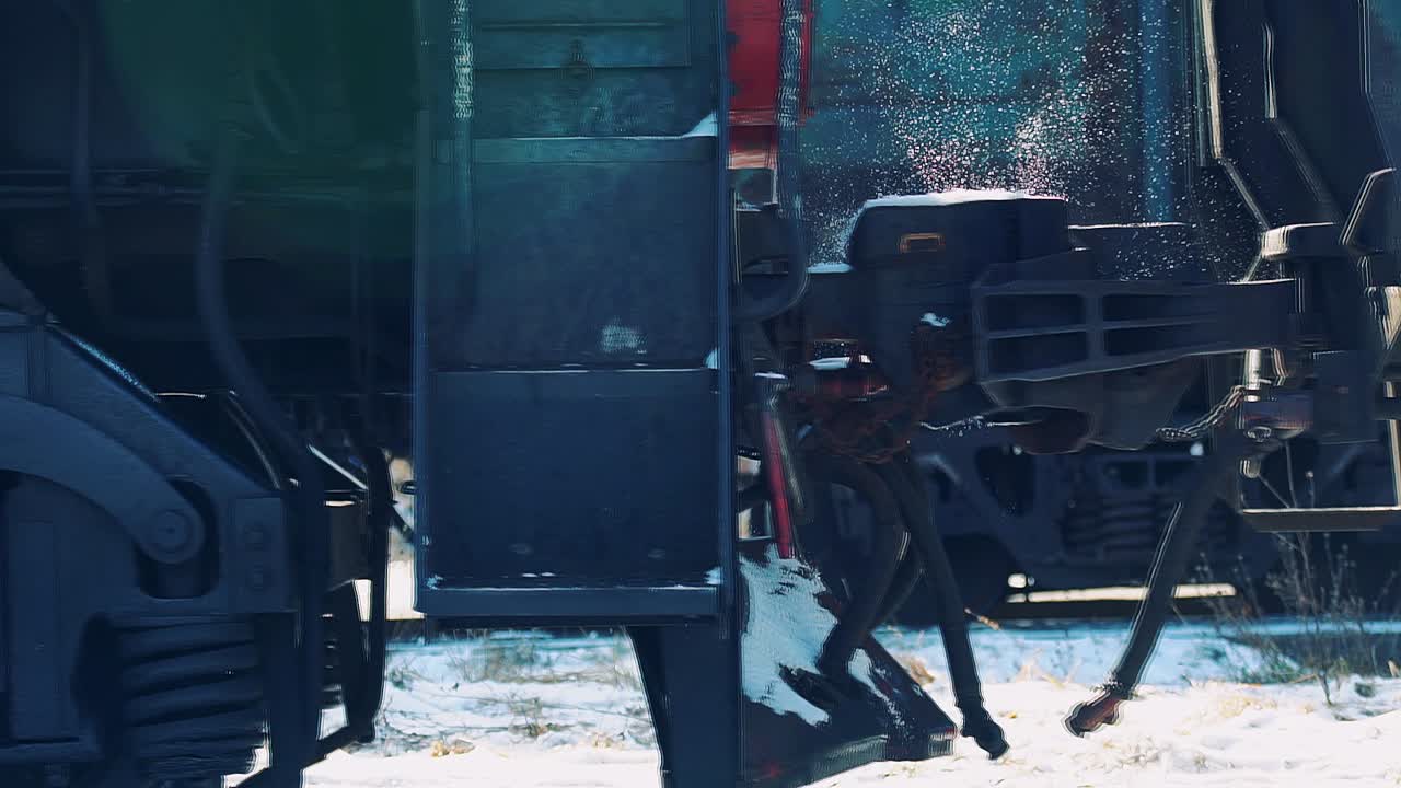 the moment the diesel locomotive is connected to the railway car. Winter is a sunny day