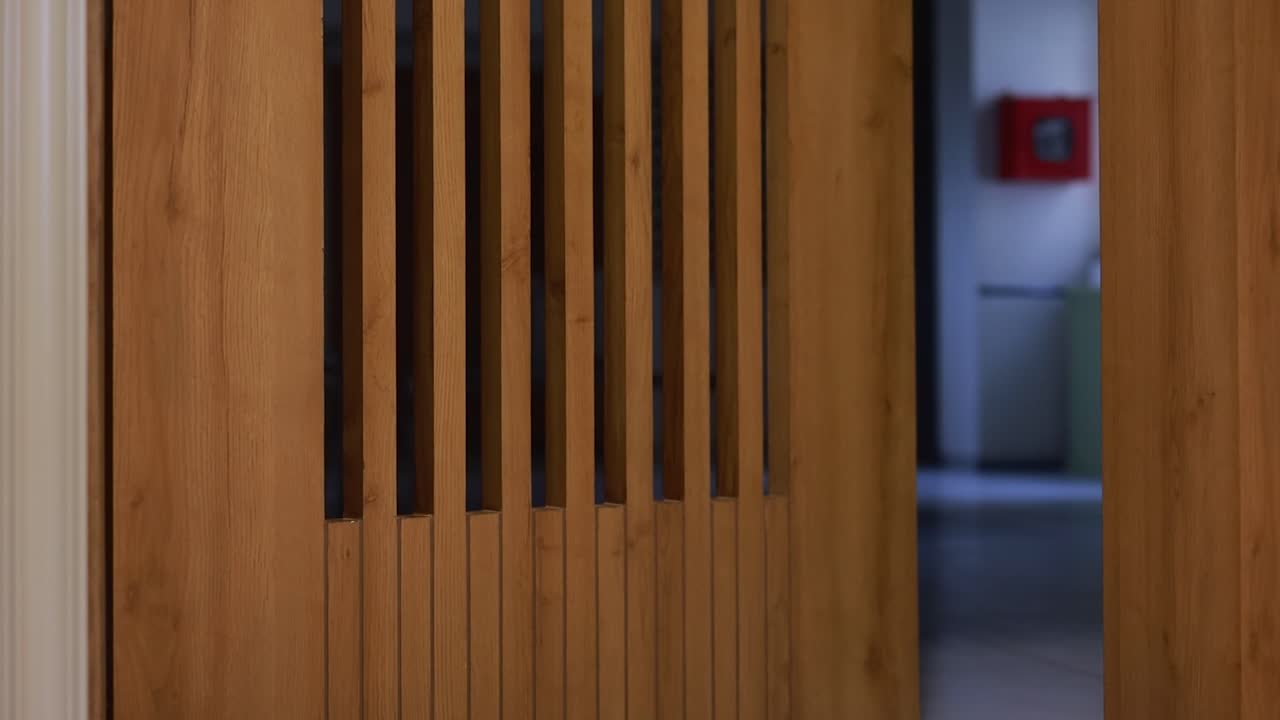 Woman Walking Through Modern Office Doorway