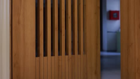 woman walking through modern office doorway