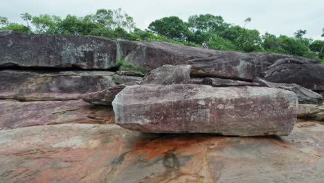 Aerial-orbital-arc-shot-of-a-rocky-coast-in-Brazil-with-forest-in-the-background