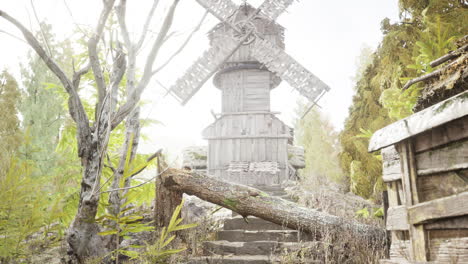 old traditional wooden windmill in the forest