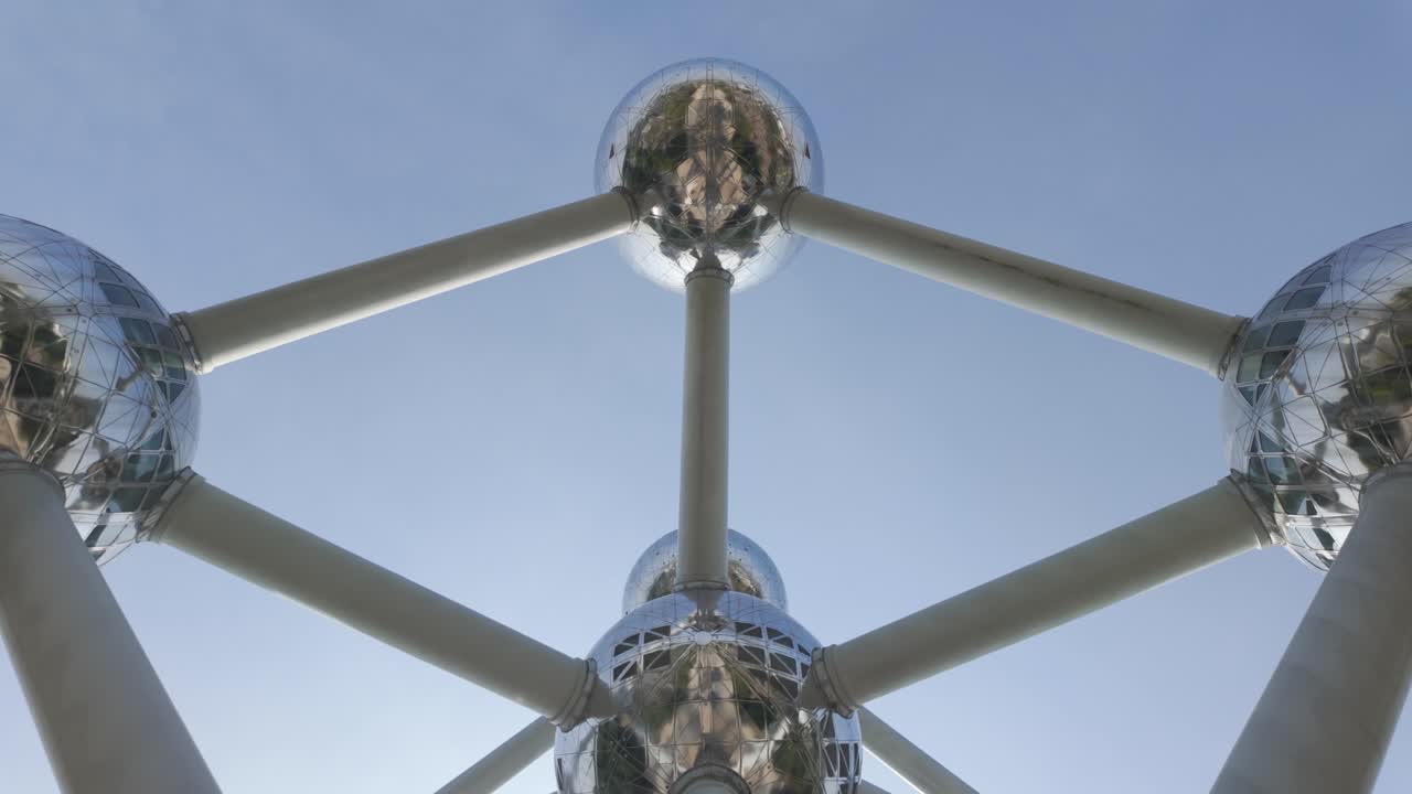 Low angle view of the Atomium in Brussels, Belgium, with reflective spheres and sky