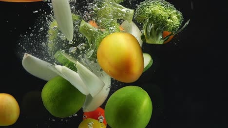 vegetables and fruits splashing in water