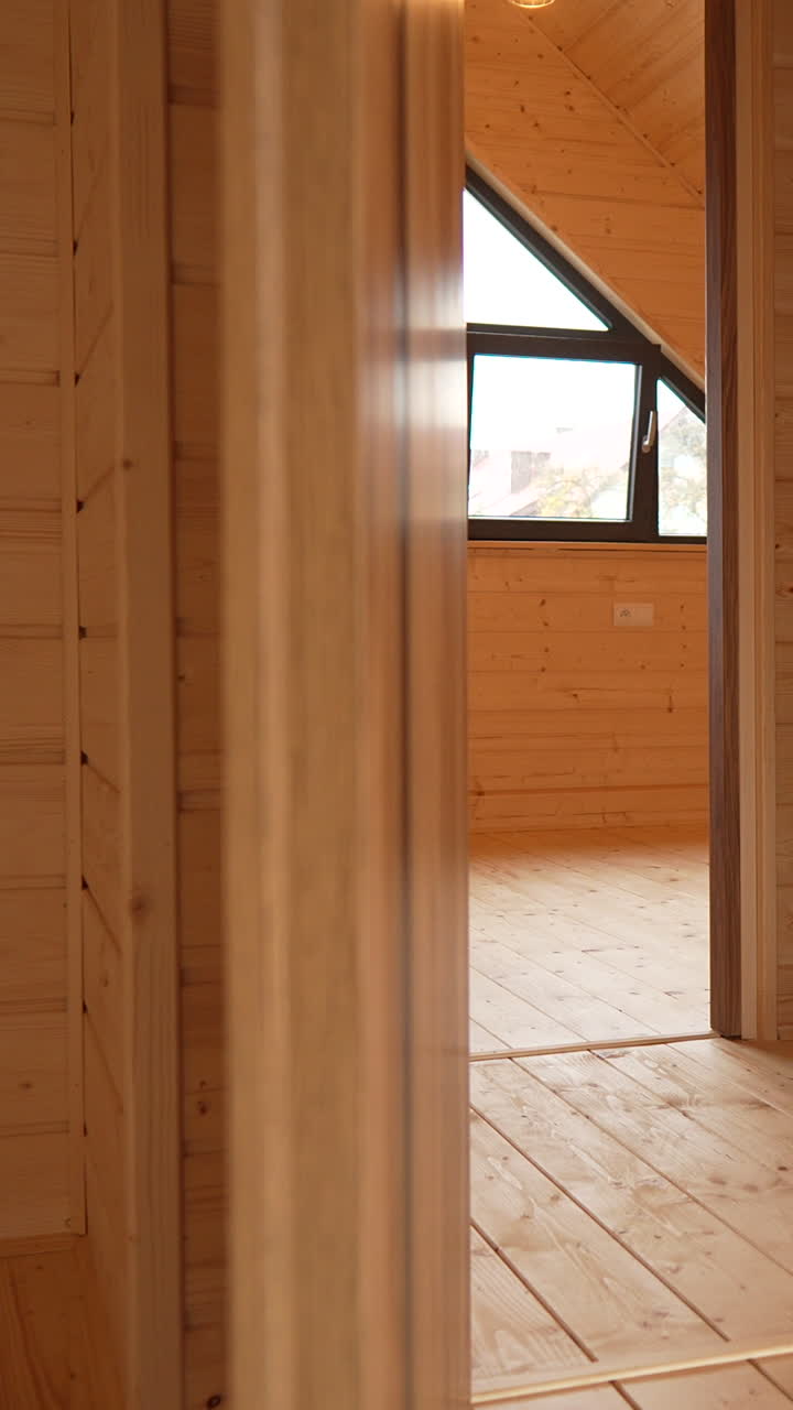The showcases a wooden interior large triangular windows. Ideal for architectural presentations, home design projects, and interior decoration showcases